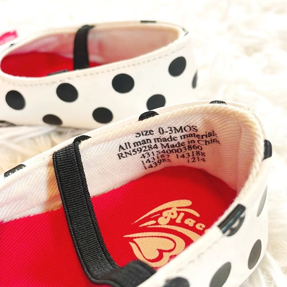 Place • Black and White Baby Polka Dot Mary Janes with Red Bow Accent Detailing